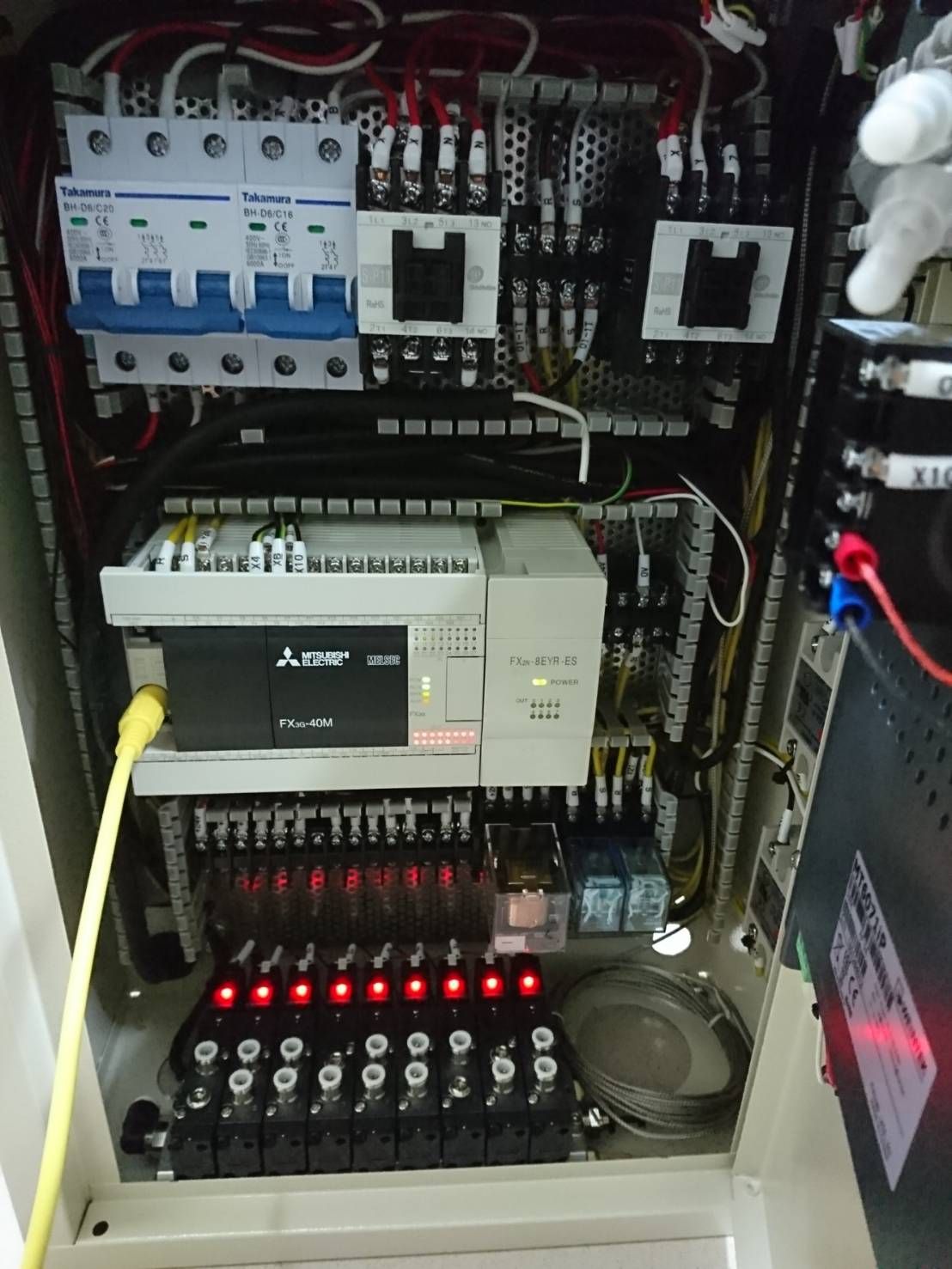 Main Mitsubishi PLC, switching devices, relays, and field terminals